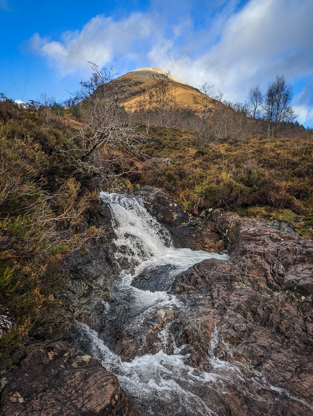 A waterfall below Buachaille Etive Beag in Glencoe, Scotland